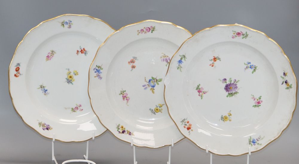 Three Meissen floral and gilt decorated plates, diameter 24cm